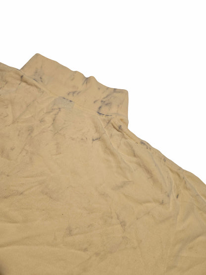 Détail d'un défaut prononcé sur un polo Ralph Lauren issu de notre sélection Grade C.